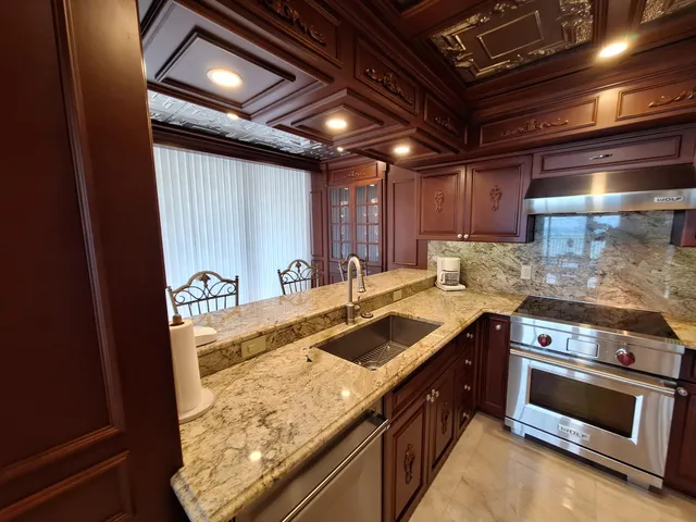 a dining room with furniture and a chandelier