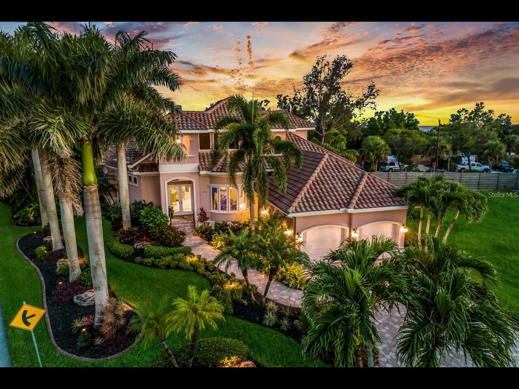 1102 Horizon View Drive Sarasota, FL 34242 - Photo 2 of 56 a view of a house with a yard and potted plants