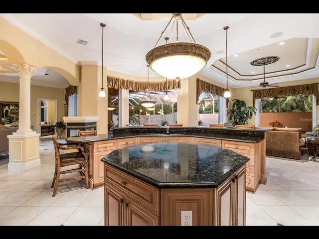 a kitchen with a table and chairs