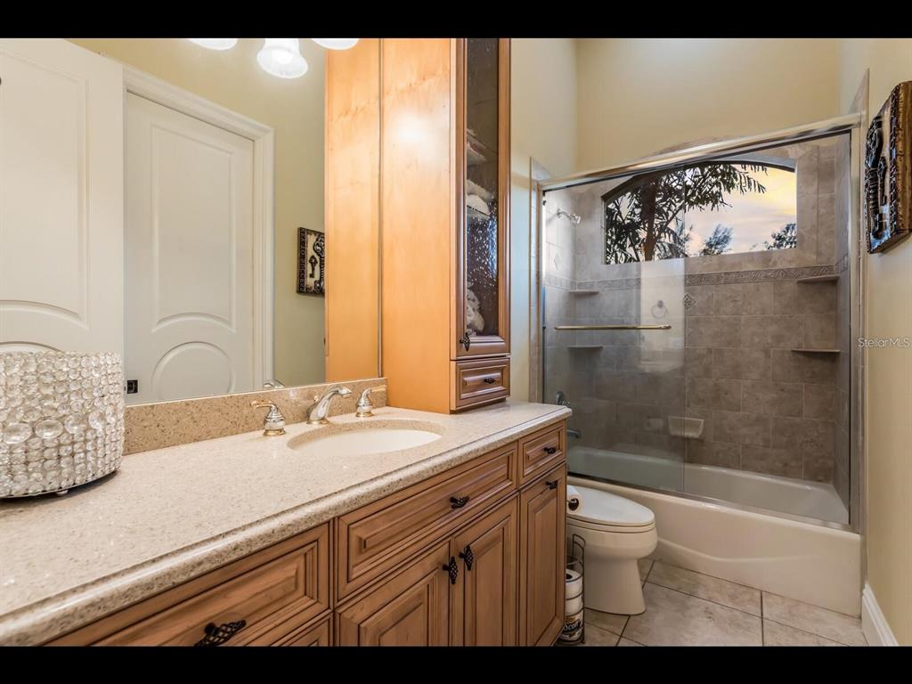 1102 Horizon View Drive Sarasota, FL 34242 - Photo 35 of 56 a bathroom with a sink a toilet and shower