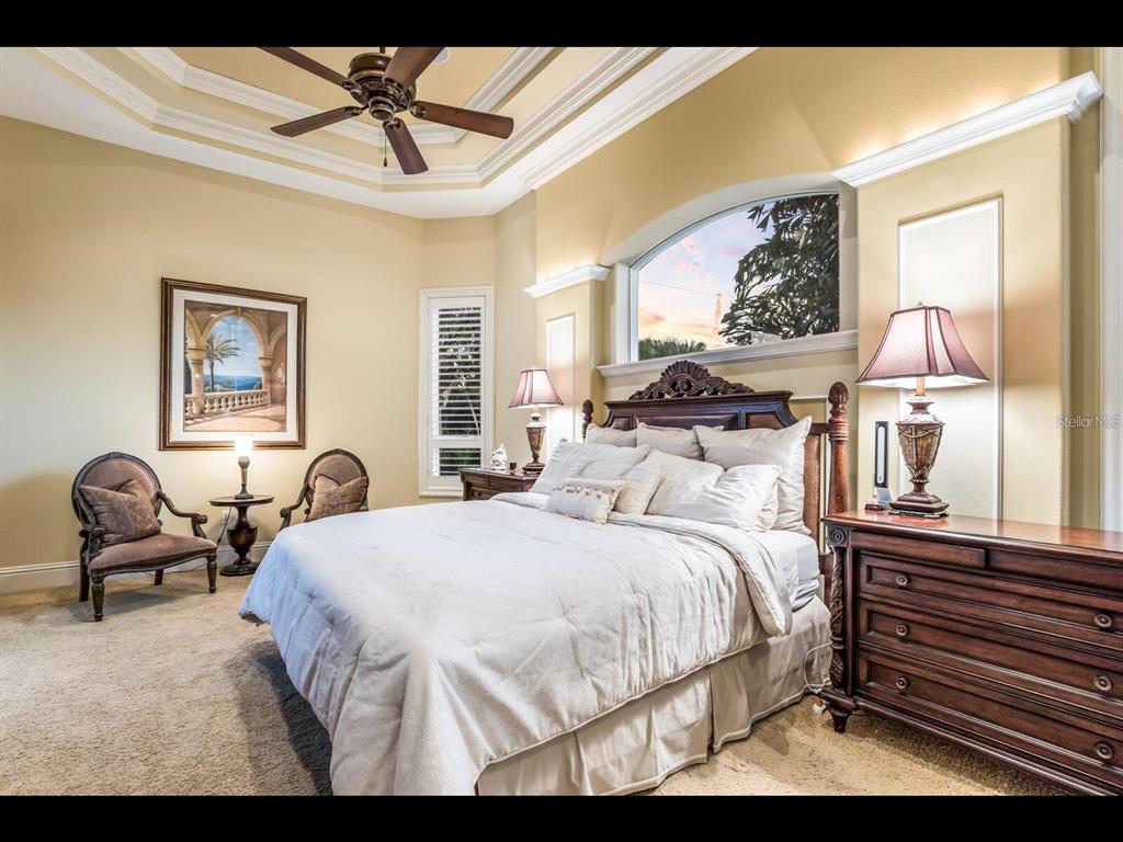 1102 Horizon View Drive Sarasota, FL 34242 - Photo 41 of 56 a bedroom with a bed and wooden floor