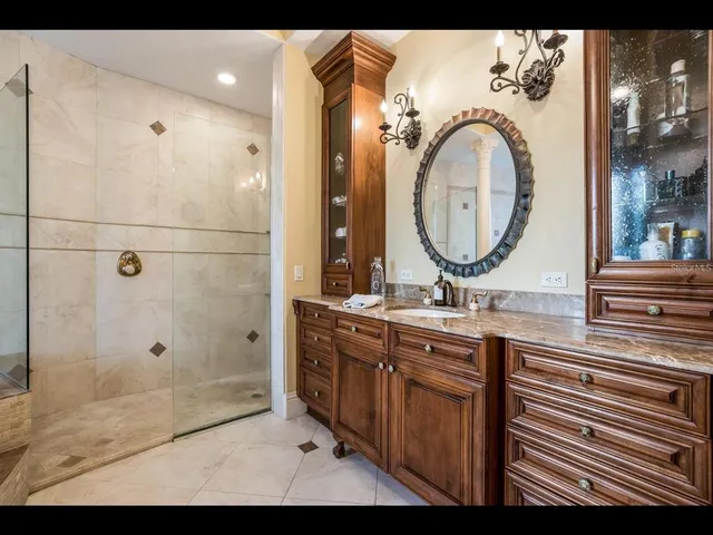 a view of a patio with table and chairs with plants