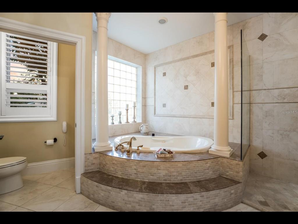 1102 Horizon View Drive Sarasota, FL 34242 - Photo 44 of 56 a bathroom with a tub and a shower