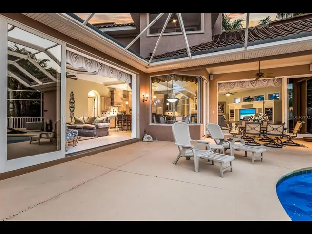 a view of a swimming pool with an outdoor seating