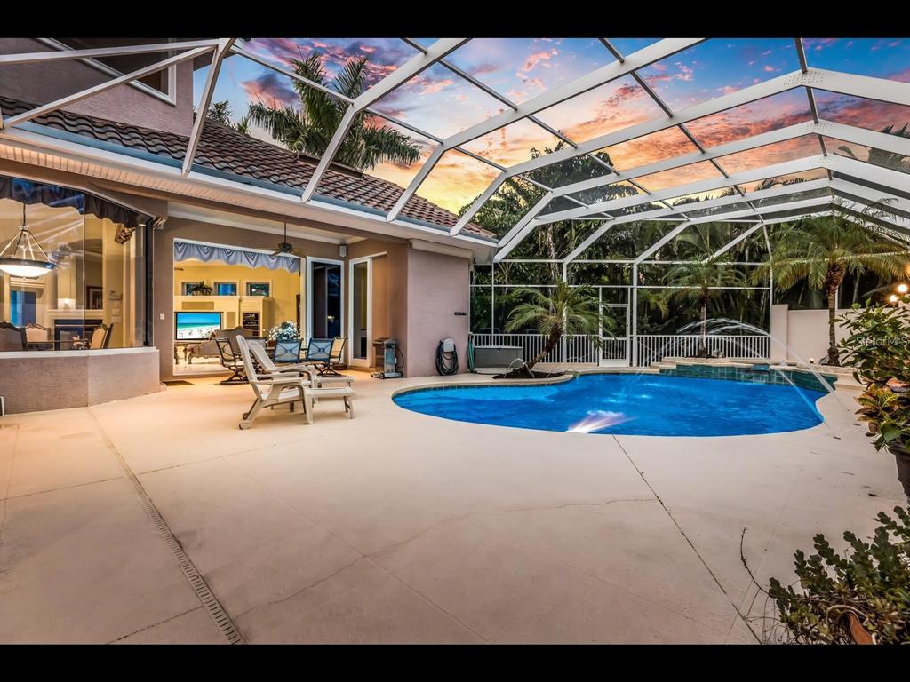 1102 Horizon View Drive Sarasota, FL 34242 - Photo 47 of 56 a view of a patio with table and chairs
