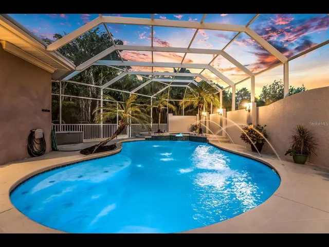 a view of a swimming pool with an outdoor space