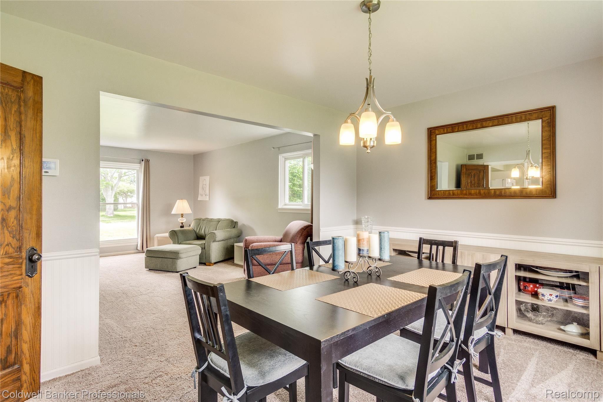 2481 Eaton Gate Road Lake Orion, MI 48360 - Photo 26 of 71 Dining room with living room in background. Great for entertaining.