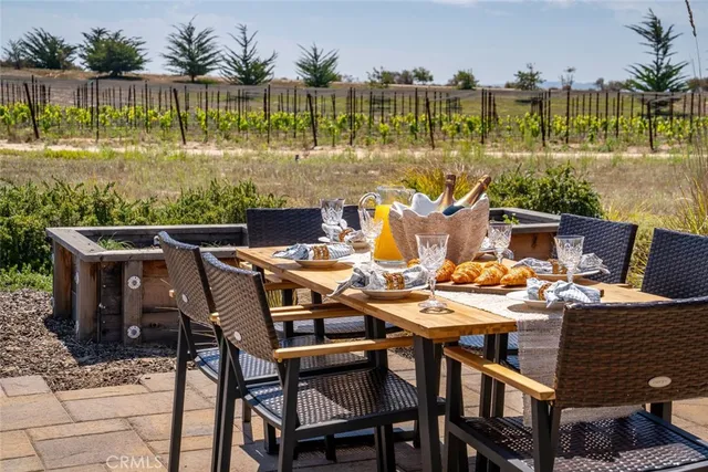a spacious bedroom with a large bed and a large window
