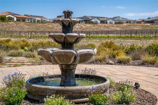 a bedroom with a bed and large windows