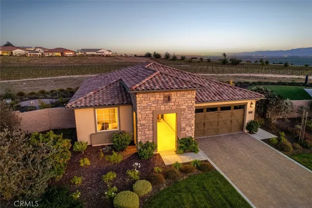 an aerial view of a house with a big yard