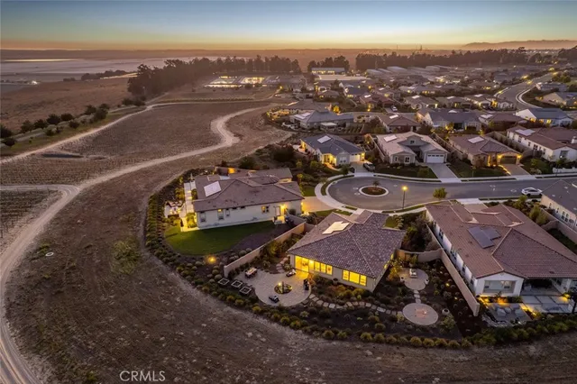 an aerial view of a house with a ocean view