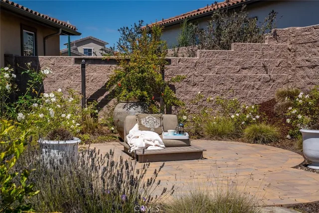 a view of a house with backyard porch and sitting area