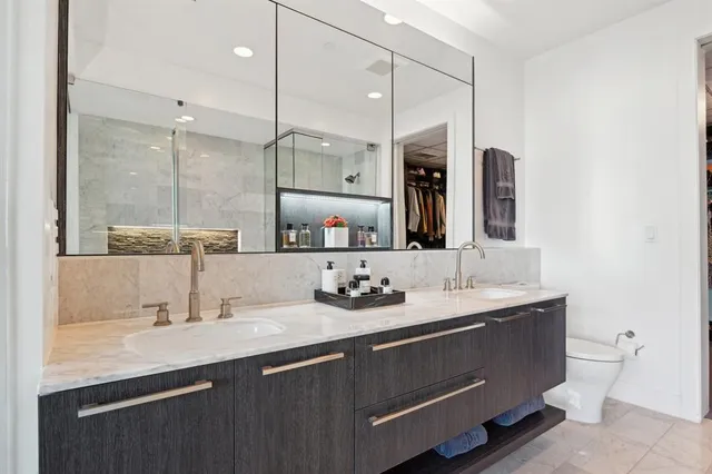 a bathroom with a sink double vanity and a mirror