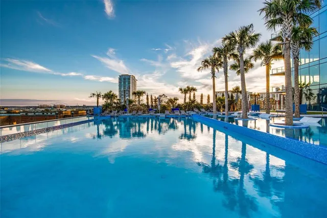 a view of swimming pool with outdoor seating