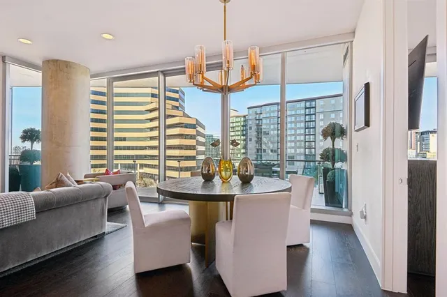 a dining room with furniture and wooden floor
