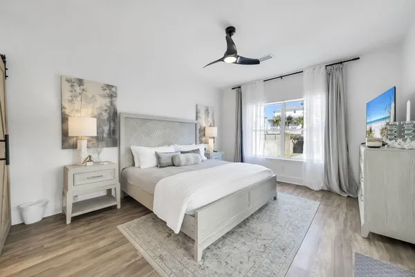 a bedroom with a large bed and a window
