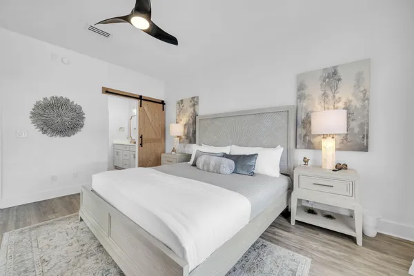 a bedroom with a bed and a cabinets