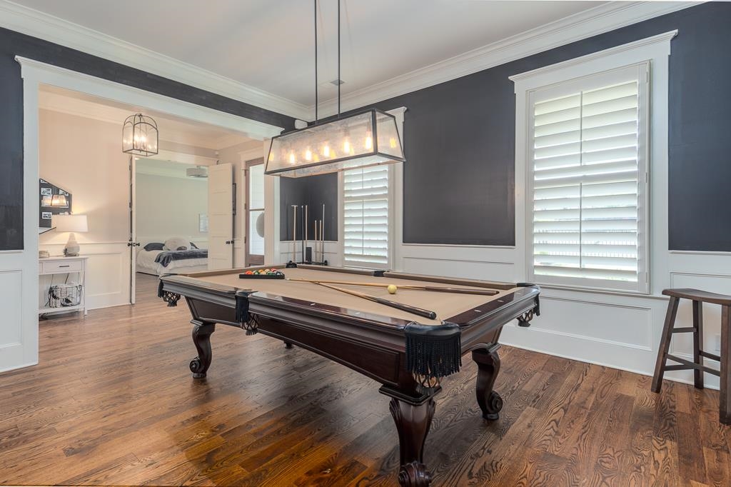 328 Washington Street Collierville, TN 38017 - Photo 13 of 33 Hardwood flooring throughout, illuminated by a rectangular chandelier