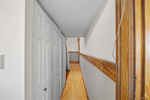 a view of entryway with wooden floor