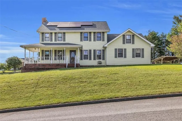 a front view of a house with swimming pool