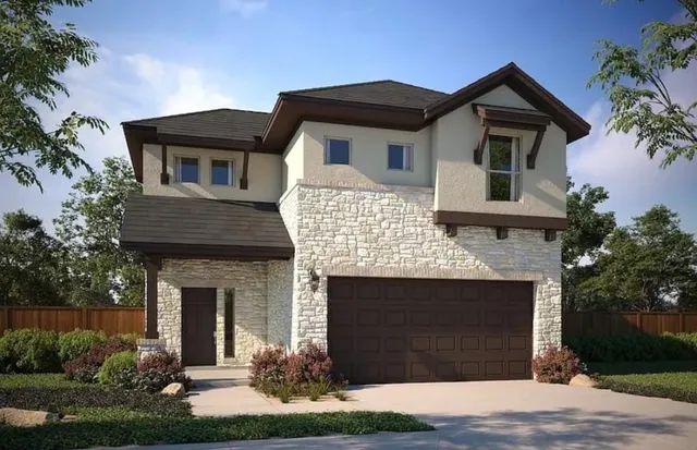 a front view of a house with a garden and plants