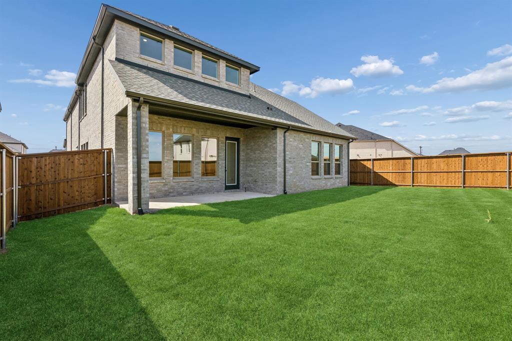15852 Amber Street Frisco, TX 75033 - Photo 17 of 19 a view of a house with backyard