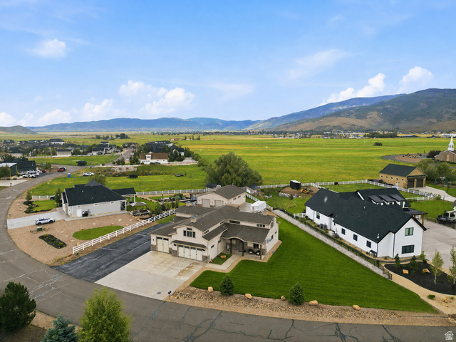 560 Aspen Road Francis, UT 84036 - Photo 1 of 59 Modern ranch-style residence featuring a multi-car garage, manicured lawn, and paved driveway