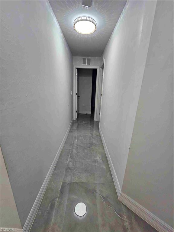3507 2nd Street Southwest Lehigh Acres, FL 33976 - Photo 11 of 27 Hall with baseboards