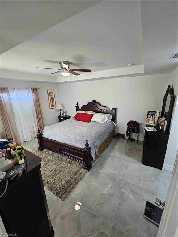 3507 2nd Street Southwest Lehigh Acres, FL 33976 - Photo 13 of 27 Bedroom with ceiling fan and marble finish floors