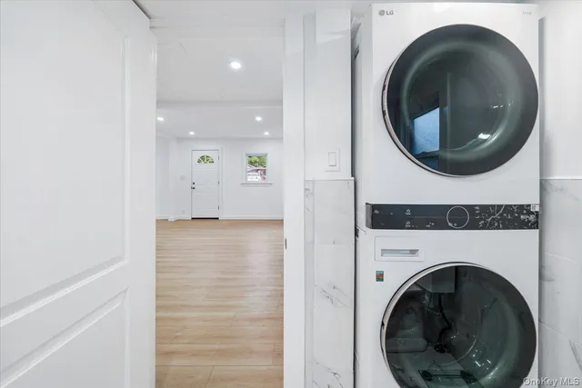 a view of a hallway with washer and dryer