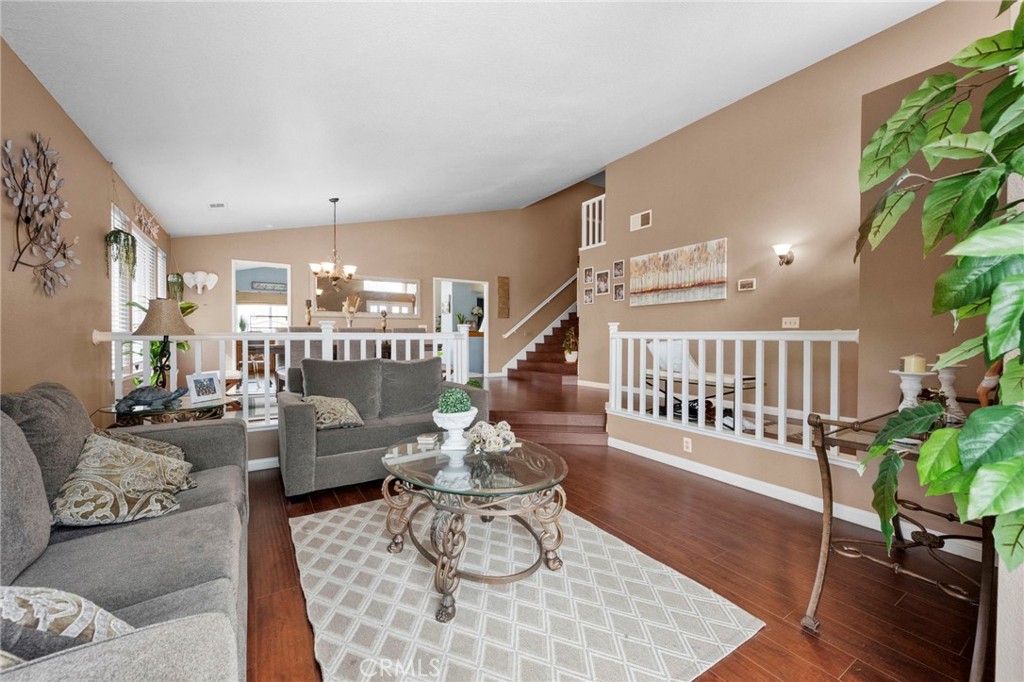 3684 North Veronica Court Rialto, CA 92377 - Photo 26 of 75 a living room with furniture and wooden floor