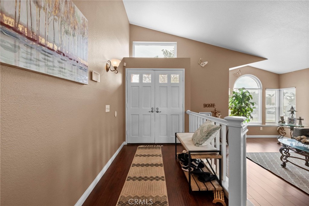 3684 North Veronica Court Rialto, CA 92377 - Photo 28 of 75 a view of a hallway with furniture and front door