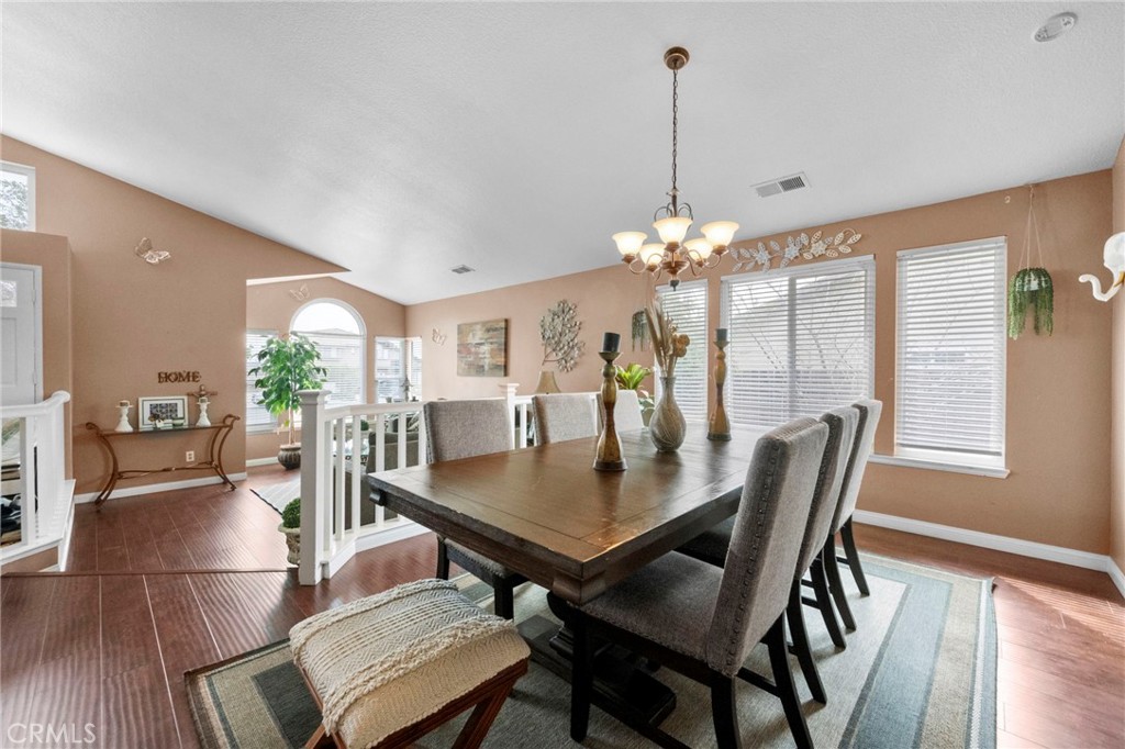 3684 North Veronica Court Rialto, CA 92377 - Photo 31 of 75 a view of a dining room with furniture window and wooden floor