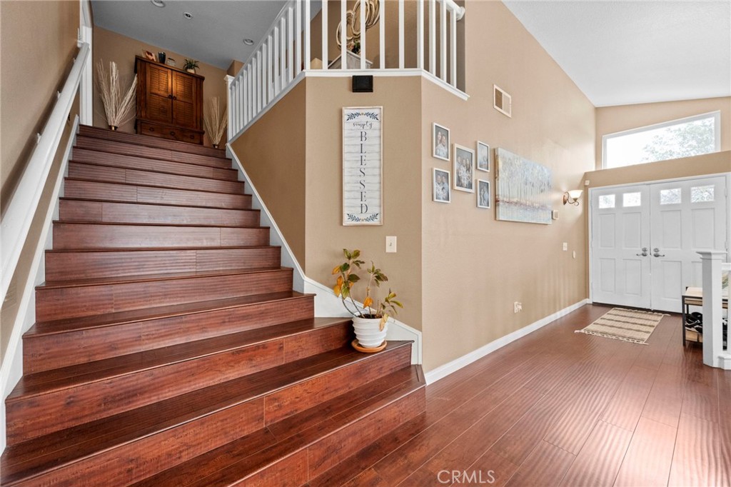 3684 North Veronica Court Rialto, CA 92377 - Photo 33 of 75 a view of staircase with lots of frames on wall and a window