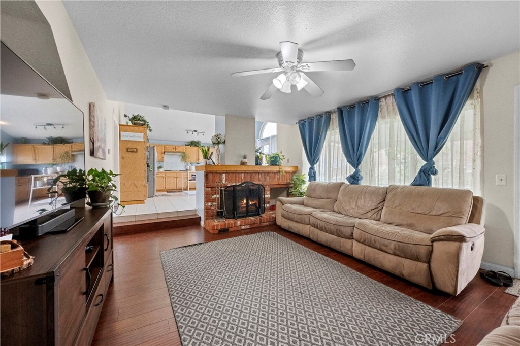 3684 North Veronica Court Rialto, CA 92377 - Photo 45 of 75 a living room with furniture and a chandelier