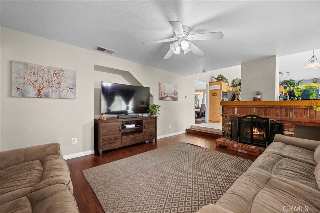 3684 North Veronica Court Rialto, CA 92377 - Photo 46 of 75 a living room with furniture and a flat screen tv
