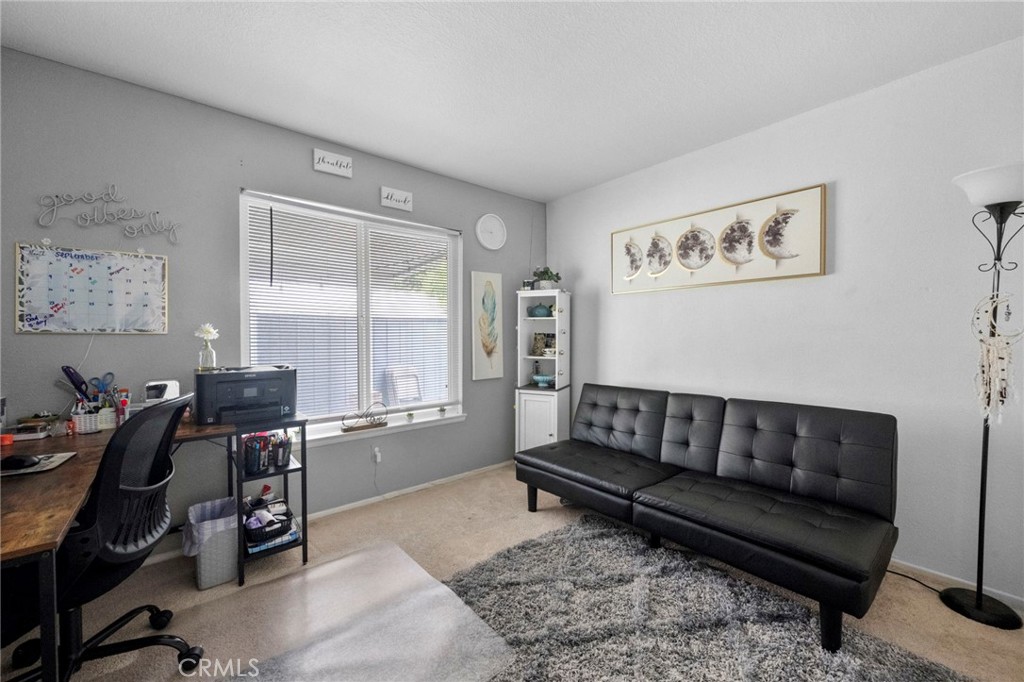 3684 North Veronica Court Rialto, CA 92377 - Photo 47 of 75 a living room with furniture and wooden floor