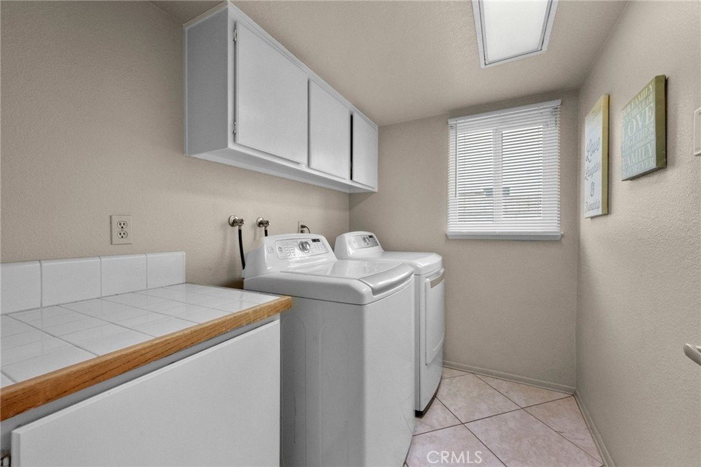 3684 North Veronica Court Rialto, CA 92377 - Photo 49 of 75 a utility room with sink dryer and washer