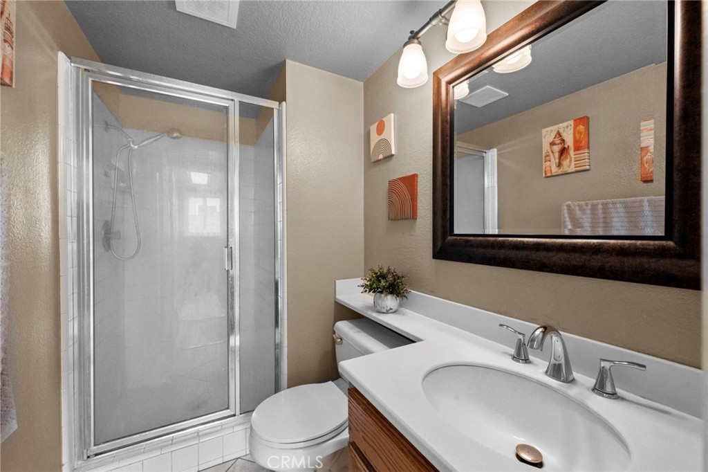 3684 North Veronica Court Rialto, CA 92377 - Photo 50 of 75 a bathroom with a sink toilet and shower