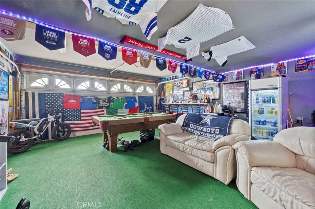 3684 North Veronica Court Rialto, CA 92377 - Photo 51 of 75 a living room with furniture and a flat screen tv