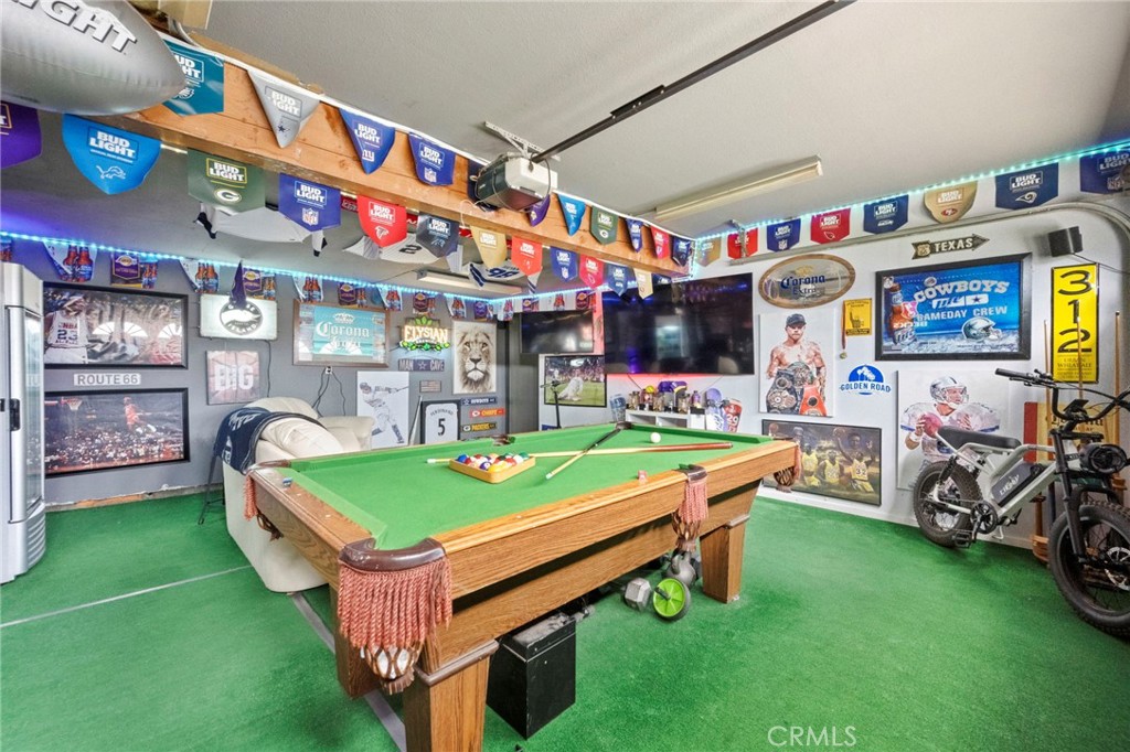 3684 North Veronica Court Rialto, CA 92377 - Photo 54 of 75 a room with musical instruments and a table