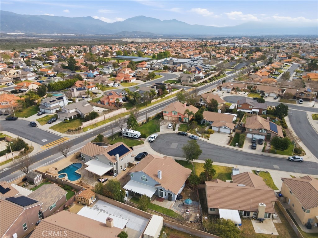 3684 North Veronica Court Rialto, CA 92377 - Photo 66 of 75 an aerial view of residential building with parking