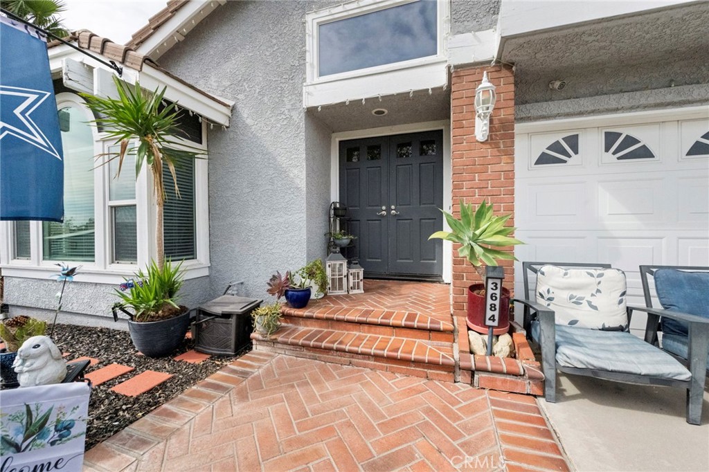 3684 North Veronica Court Rialto, CA 92377 - Photo 7 of 75 a view of a chair and tables in the patio front of a house