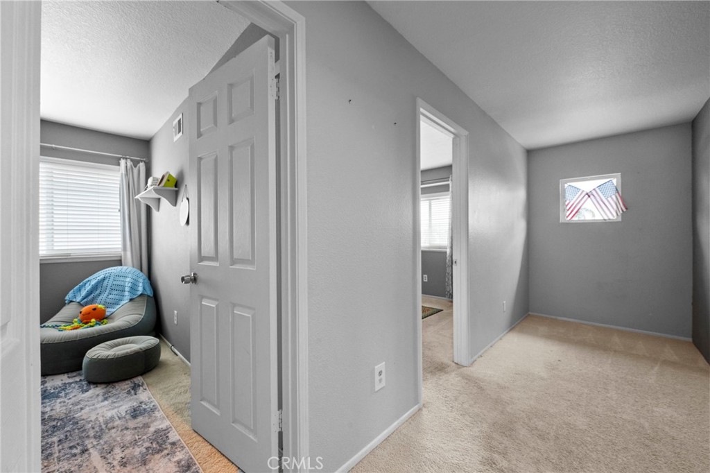 3684 North Veronica Court Rialto, CA 92377 - Photo 9 of 75 a living room with furniture and a window