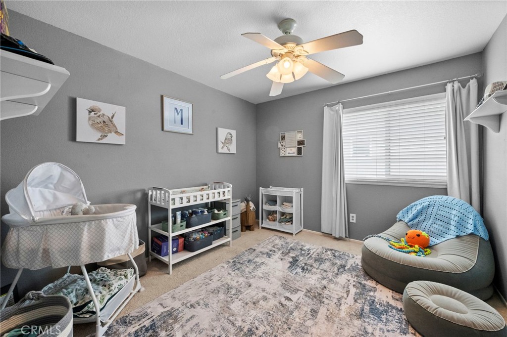 3684 North Veronica Court Rialto, CA 92377 - Photo 10 of 75 a living room with furniture and a window