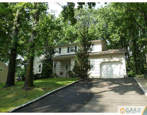 5 Sherwood Road Edison, NJ 08820 - Photo 1 of 10 a front view of a house with a garden