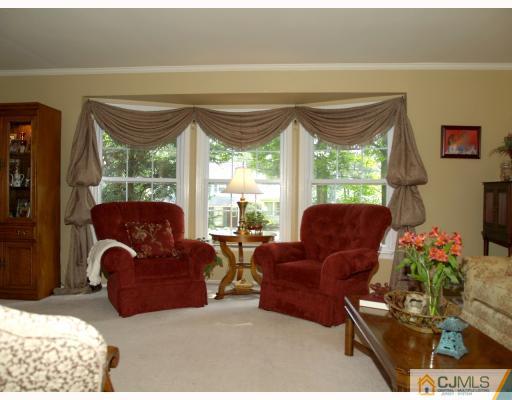 5 Sherwood Road Edison, NJ 08820 - Photo 2 of 10 a living room with furniture and a large window