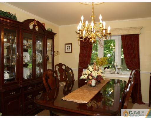 5 Sherwood Road Edison, NJ 08820 - Photo 3 of 10 a view of a dining room with furniture and chandelier
