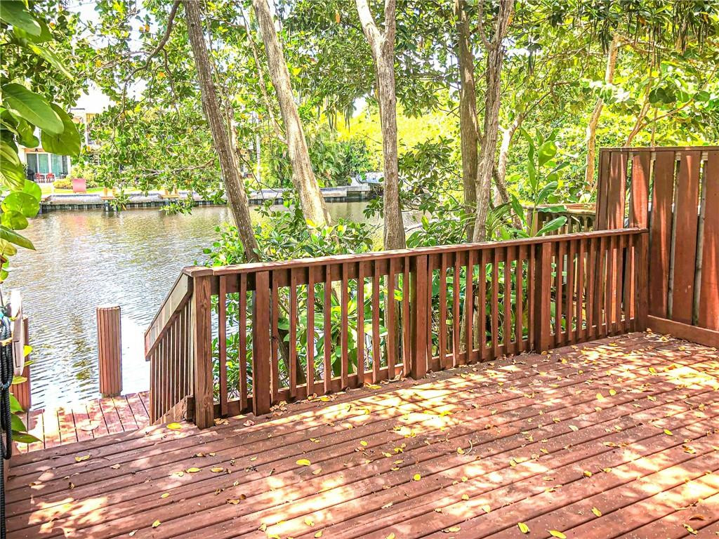 2000 Riverside Place, Unit 4 Wilton Manors, FL 33305 - Photo 1 of 40 a view of entrance gate with wooden fence