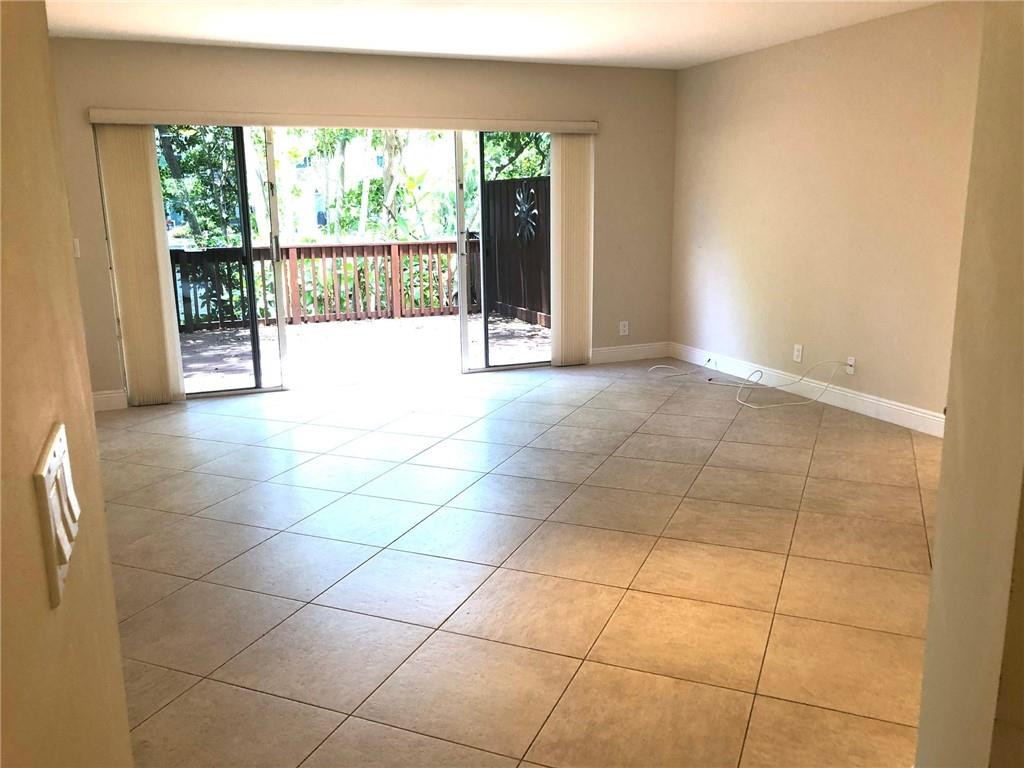 2000 Riverside Place, Unit 4 Wilton Manors, FL 33305 - Photo 16 of 40 a view of an empty room with a window